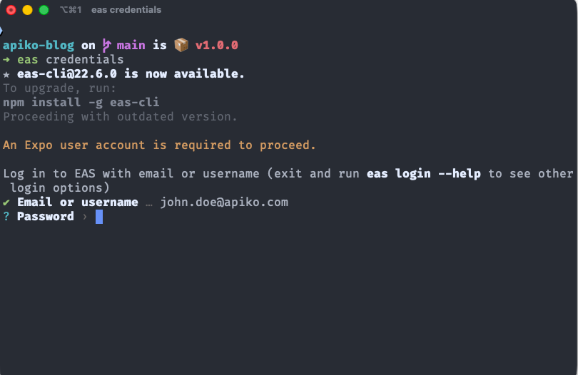 Terminal window running eas credentials in a project called apiko-blog. The CLI reports that a newer eas-cli version is available, then states that an Expo user account is required to proceed and prompts for email and password